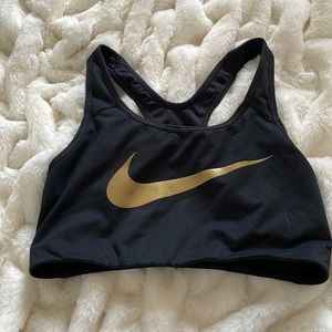 Black Nike Dri-Fit Sportsbra with A Gold Nike Sign